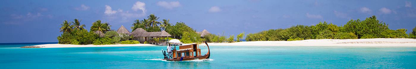 View of a holiday bungalow in an isolated island surrounded by the sea at Maldives