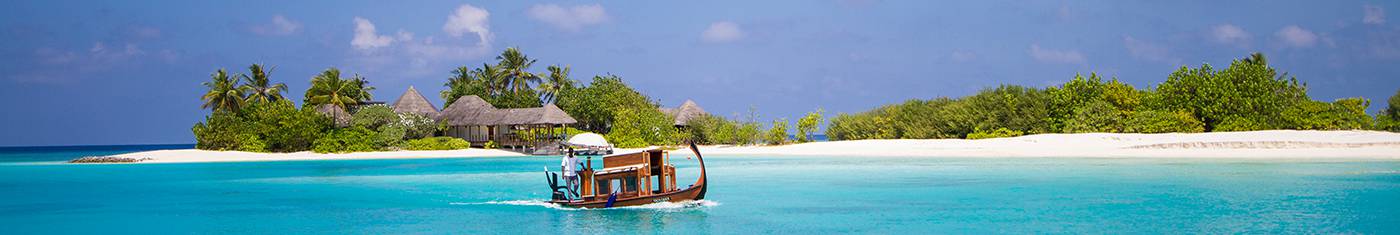View of a holiday bungalow in an isolated island surrounded by the sea at Maldives