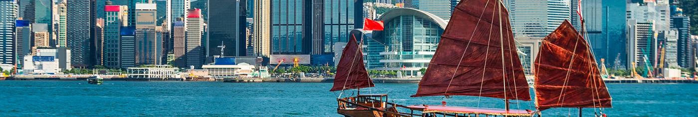 Yacht is sailing overlooking skyscrapers of the land