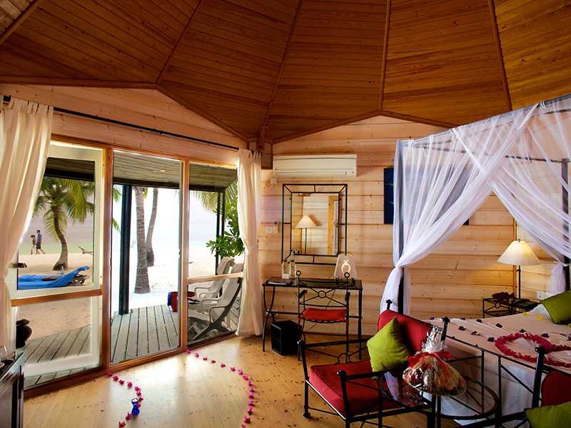 Jacuzzi beach villa with wooden flooring