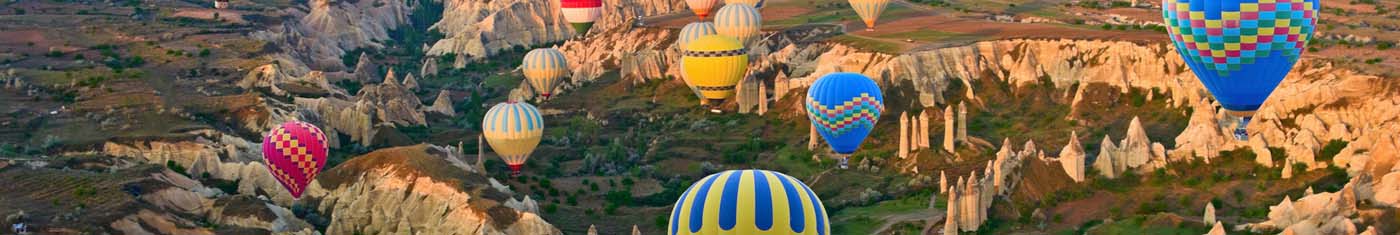 View of hot air ballooning in the sky with plenty of multi colored balloons
