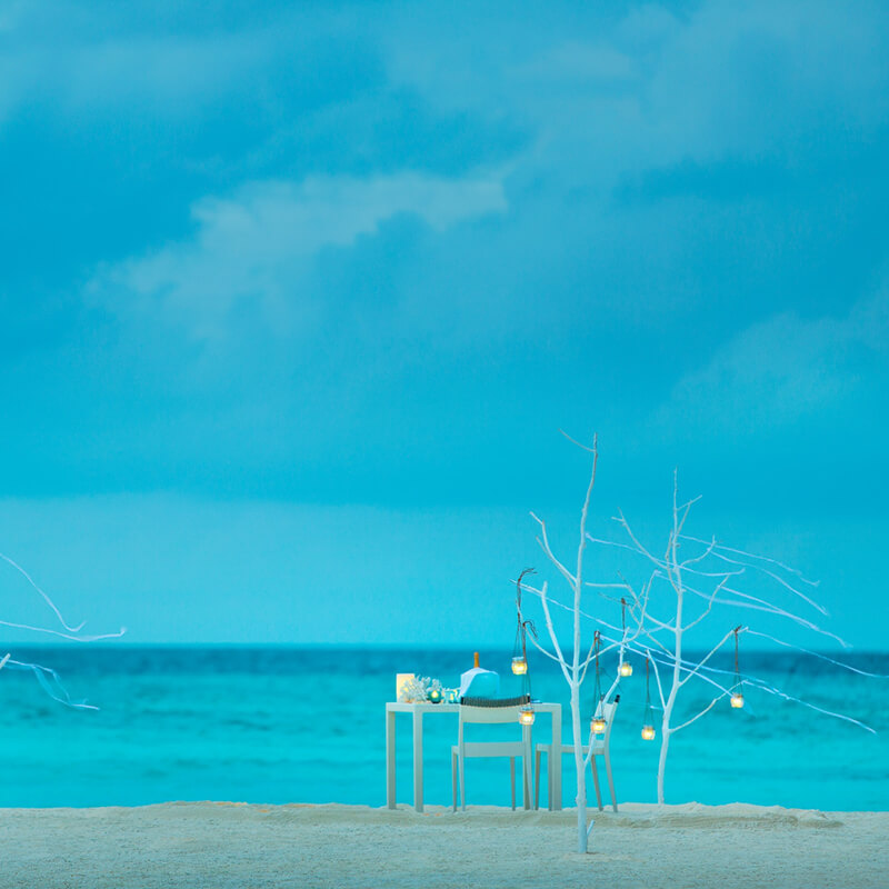 Distance view of the private dining table in the beach