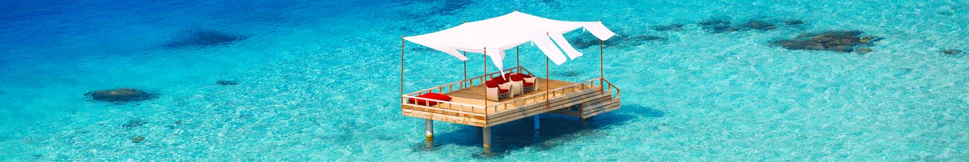 Distance views of overwater relaxing suits with comfy sofa