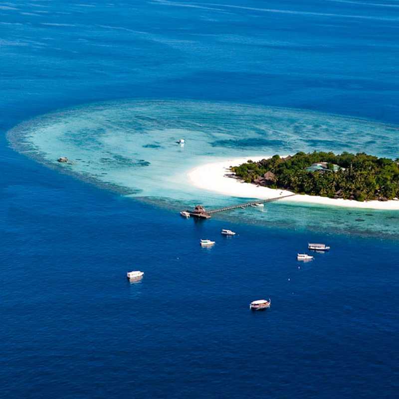 Arial view of the isolated island in Maldives with cruises